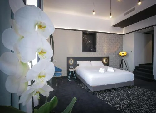 Chambre de Le Magic Hôtel & Spa - Centre Historique - Parking Privé - Piscine - Sauna - Bornes de recharges